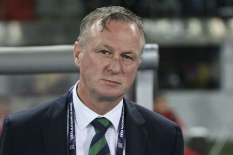 FILE - In this Friday, Oct. 12, 2018 file photo, Northern Ireland coach Michael O'Neill stands prior to the start of the UEFA Nations League soccer match between Austria and Northern Ireland at Ernst Happel stadium in Vienna, Austria. Northern Ireland coach Michael ONeill left the job on Wednesday April 22, 2020, citing uncertainty over the teams European Championship playoffs due to the coronavirus pandemic. (AP Photo/Ronald Zak, File)