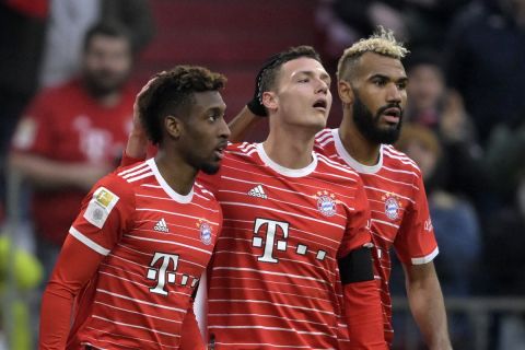 Bayern's Kingsley Coman celebrates wiyth teammates after scoring his side's second goal during the Bundesliga soccer match between Bayern Munich and VfL Bochum 1848 at the Allianz Arena in Munich, Germany, Saturday, Feb.11, 2023. (AP Photo/Andreas Schaad)