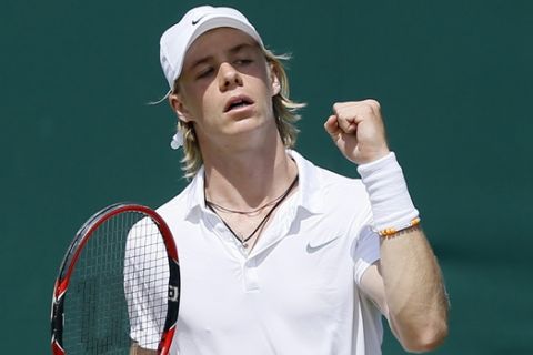 Denis Shapovalov of Canada celebrates a point against Mate Valkusz of Hungary during their men's singles match on day eleven of the Wimbledon Tennis Championships in London, Thursday, July 7, 2016. (AP Photo/Kirsty Wigglesworth)