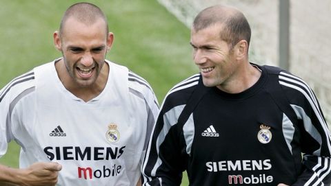 Real Madrid's Raul Bravo, left runs with Zinedine Zidane of France during a training session in Madrid Tuesday May 10, 2005.  With only three matches left to the end of the season, Real Madrid are still chasing rivals Barcelona for the league title but trail by six points. (AP Photo/Manu Fernandez)