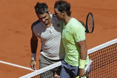 Spain's Rafael Nadal, right, is congratulated by Switzerland's Roger Federer after winning their semifinal match of the French Open tennis tournament at the Roland Garros stadium in Paris, Friday, June 7, 2019. (AP Photo/Pavel Golovkin)