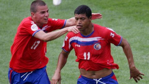 Costa Rica's Ronald Gomez, right, is about to be hugged by Gabriel Badilla, left after he scored during the Costa Rica vs Poland, Group A, World Cup 2006, soccer match at World Cup stadium in Hanover, Germany, on Tuesday, June 20, 2006. The other teams in Group A are Ecuador and Germany. (AP Photo/Fabian Bimmer) **MOBILE/PDA USAGE OUT**