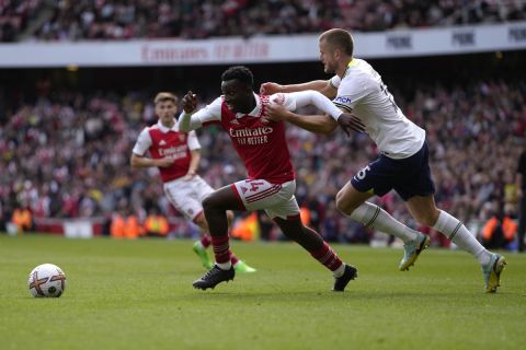 Arsenal's Eddie Nketiah, left, is challenged by Tottenham's Eric Dier during the English Premier League soccer match between Arsenal and Tottenham Hotspur, at Emirates Stadium, in London, England, Saturday, Oct. 1, 2022. (AP Photo/Kirsty Wigglesworth)
