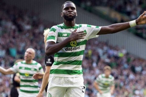 Celtic's Odsonne Edouard celebrates scoring his side's first goal of the game during the Champions League second qualifying round, first leg soccer match between Celtic and Rosenborg, at Celtic Park, Glasgow, Scotland, Wednesday, July 25, 2016. (Jeff Holmes/PA via AP)