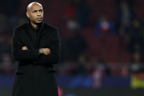 FILE - In this Wednesday, Nov. 28, 2018 file photo, Monaco coach Thierry Henry watches his players before the Group A Champions League soccer match between Atletico Madrid and Monaco at the Metropolitano stadium in Madrid. Former Arsenal teammates, Thierry Henry and Cesc Fabregas are back together at Monaco, where Henrys first coaching role is turning into a desperate battle against relegation. (AP Photo/Manu Fernandez, File)