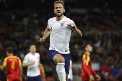 England's Harry Kane celebrates scoring his side's third goal during the Euro 2020 group A qualifying soccer match between England and Montenegro at Wembley stadium in London, Thursday, Nov. 14, 2019. (AP Photo/Kirsty Wigglesworth)