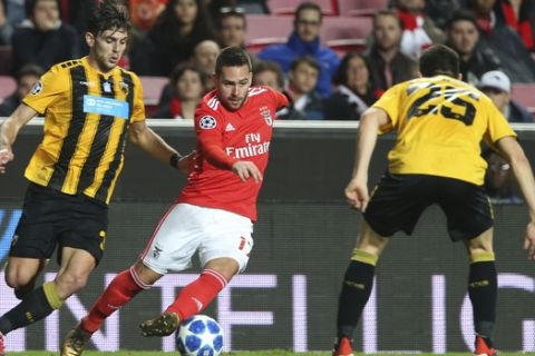 Benfica's Andrija Zivkovic, center, vies the ball past AEK's Kostas Galanopoulos, right, and AEK's Lucas Boye, left, during the Champions League group E soccer match between Benfica and AEK Athens at the Luz stadium in Lisbon, Wednesday, Dec. 12, 2018. (AP Photo/Armando Franca)