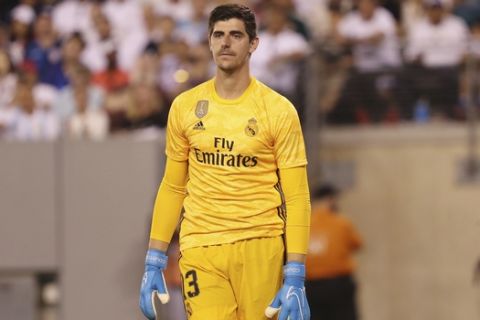 Real Madrid goalkeeper Thibaut Courtois in action during the first half of an International Champions Cup soccer match against Atletico Madrid, Friday, July 26, 2019, in East Rutherford, N.J. Atletico Madrid won 7-3. (AP Photo/Steve Luciano)