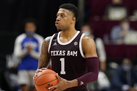 Texas A&M guard Savion Flagg (1) looks to pass against New Orleans during the second half of an NCAA college basketball game Sunday, Nov. 29, 2020, in College Station, Texas. (AP Photo/Sam Craft)