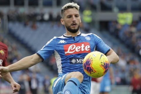 Napoli's Dries Mertens kicks the ball during an Italian Serie A soccer match between Roma and Napoli, at the Olympic stadium in Rome, Saturday, Nov. 2, 2019. (AP Photo/Gregorio Borgia)