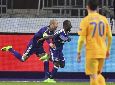 Anderlecht's Frank Acheampong, center, celebrates with teammate Anderlecht's Sofiane Hanni, left, after scoring a goal during a Europa League round of 16, second leg, soccer match between Anderlecht and APOEL at the Constant Vanden Stock stadium in Brussels, on Thursday, March 16, 2017. (AP Photo/Geert Vanden Wijngaert)