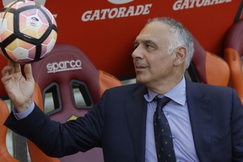 FILE - In this Sunday, May 28, 2017 file photo AS Roma president James Pallotta plays with a ball prior to an Italian Serie A soccer match between Roma and Genoa at the Olympic stadium in Rome, Sunday, May 28, 2017. The American president of the Roma soccer club is running out of patience. If regional authorities don't approve construction of a long-delayed new stadium for the team, Boston executive James Pallotta is prepared to sell the team. (AP Photo/Alessandra Tarantino, File)