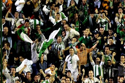Fans celebrate as Real Betis player Dani Martin, from Spain, down, celebrates his goal on the shoulders of his teammates during their Group G Champions League soccer match against Chelsea in Seville, Spain, Tuesday, Nov. 1, 2005. (AP Photo/Jasper Juinen)