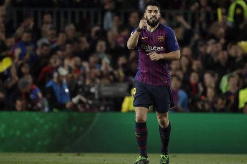 Barcelona's Luis Suarez celebrates after scoring his side's opening goal during the Champions League semifinal, first leg, soccer match between FC Barcelona and Liverpool at the Camp Nou stadium in Barcelona, Spain, Wednesday, May 1, 2019. (AP Photo/Emilio Morenatti)