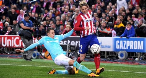 "MADRID, SPAIN - MARCH 15:  Fernando Torres of Club Atletico de Madrid is tackled by Santiago Arias of PSV Eindhoven during the  UEFA Champions League round of 16 second leg match between Club Atletico de Madrid and PSV Eindhoven at Vincente Calderon on March 15, 2016 in Madrid, Spain.  (Photo by Denis Doyle - UEFA/UEFA via Getty Images)"