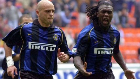 Internazionale of Milan Greek defender Gregorios Georgatos, left, celebrates with Dutch teammate Clarence Seedorf after scoring during an Italian first division match between Inter and Bologna at the San Siro stadium in Milan, Italy, Sunday, Sept. 30, 2001. (AP Photo/Antonio Calanni)         
