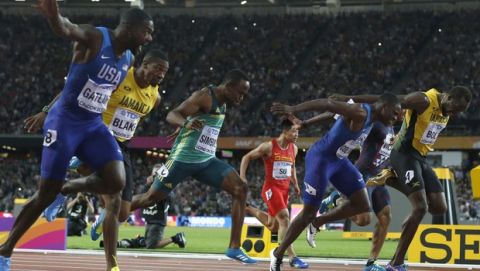 United States' Justin Gatlin, left, crosses the line to win gold ahead of silver medal winner United States' Christian Coleman, second right, and bronze medal winner Jamaica's Usain Bolt, right, in the men's 100m final during the World Athletics Championships in London Saturday, Aug. 5, 2017. (AP Photo/Matt Dunham)
