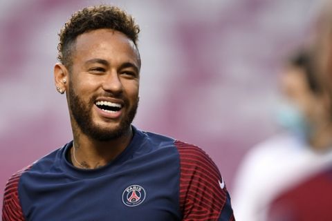 PSG's Neymar smiles during a training session at the Luz stadium in Lisbon, Saturday Aug. 22, 2020. PSG will play Bayern Munich in the Champions League final soccer match on Sunday. (David Ramos/Pool via AP)