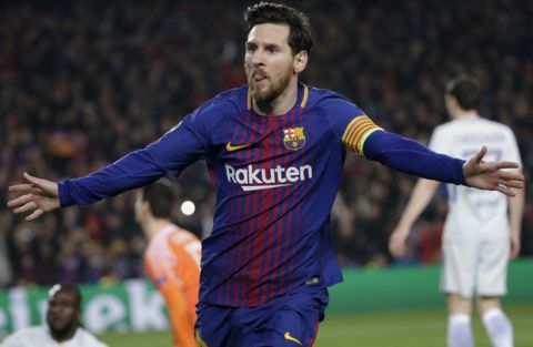 Barcelona's Lionel Messi celebrates after scoring his side's third goal during the Champions League round of sixteen second leg soccer match between FC Barcelona and Chelsea at the Camp Nou stadium in Barcelona, Spain, Wednesday, March 14, 2018. (AP Photo/Emilio Morenatti)