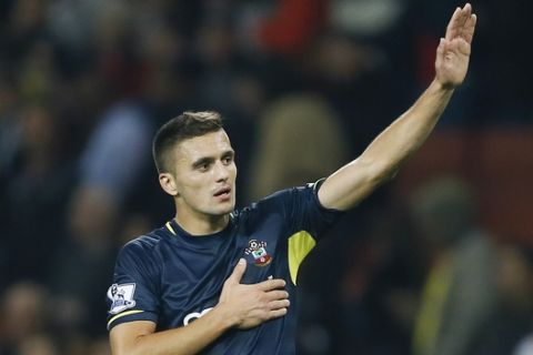 Southampton's Dusan Tadic celebrates at the end of the match after winning the English League Cup soccer match between Arsenal and Southampton at Emirates Stadium in London, Tuesday, Sept. 23, 2014. (AP Photo/Kirsty Wigglesworth) 