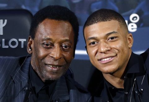 Brazilian soccer legend Pele, left, and French soccer player Kylian Mbappe pose during a photocall in Paris, Tuesday, April 2, 2019. (AP Photo)