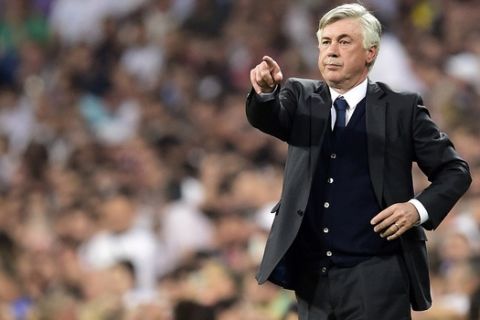Real Madrid's Italian coach Carlo Ancelotti gestures during the UEFA Champions League semi-final second leg football match Real Madrid FC vs Juventus at the Santiago Bernabeu stadium in Madrid on May 13, 2015.   AFP PHOTO/ GERARD JULIEN        (Photo credit should read GERARD JULIEN/AFP/Getty Images)