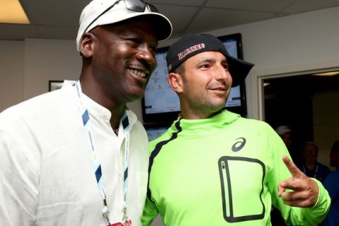NEW YORK, NY - AUGUST 26:  Marinko Matosevic of Australia poses with basketball Hall of Famer Michael Jordan following his men's singles first round match against  Roger Federer of Switzerland on Day Two of the 2014 US Open at the USTA Billie Jean King National Tennis Center on August 26, 2014  in the Flushing neighborhood of the Queens borough of New York City.  (Photo by Matthew Stockman/Getty Images) ORG XMIT: 507831373 ORIG FILE ID: 454229590