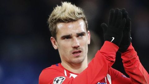 FILE - A Tuesday, Dec. 5, 2017 file photo of Atletico's Antoine Griezmann greeting fans after the 1-1 draw in the Champions League Group C soccer match between Chelsea and Atletico Madrid at Stamford Bridge stadium in London.  Griezmann has apologized after posting an image of himself on social media in blackface as part of an NBA party costume on Sunday, Dec. 17, 2017. (AP Photo/Frank Augstein, File)