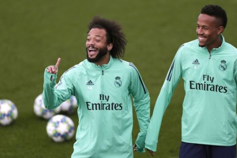 Real Madrid's Marcelo, left, and Militao take part in a training session at the team's Valdebebas training ground in Madrid, Spain, Tuesday, Nov. 5, 2019. Real Madrid will play against Galatasaray in a Champions League soccer match Group A on Wednesday. (AP Photo/Manu Fernandez)