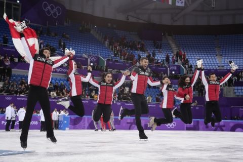 The Canadian team pose for a group photo following the Venue Ceremony after winning the gold medal in the figure skating team event in the Gangneung Ice Arena at the 2018 Winter Olympics in Gangneung, South Korea, Monday, Feb. 12, 2018. (AP Photo/Julie Jacobson)