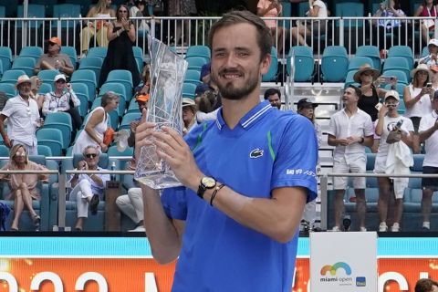 Daniil Medvedev, of Russia, poses with his trophy after beating Jannik Sinner, of Italy, 7-5, 6-3, during the men's singles finals of the Miami Open tennis tournament, Sunday, April 2, 2023, in Miami Gardens, Fla. (AP Photo/Wilfredo Lee)