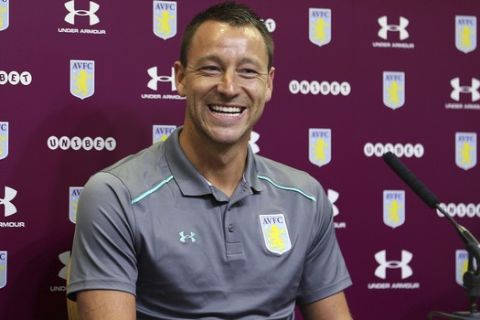 New Aston Villa signing John Terry, reacts during the media conference at Villa Park, Birmingham, England, Monday July 3, 2017.  Former England and Chelsea captain John Terry has signed a one-year deal with second-division Aston Villa, saying he is "delighted" and is looking to "help the squad achieve something special this season."(Aaron Chown/PA via AP)