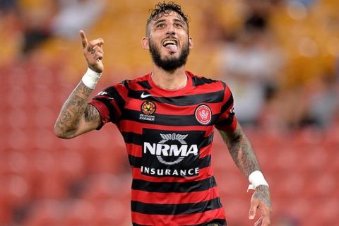 BRISBANE, AUSTRALIA - MARCH 25:  Kerem Bulut of the Western Sydney Wanderers celebrates after scoring a goal during the round 21 A-League match between Brisbane Roar and the Western Sydney Wanderers at Suncorp Stadium on March 25, 2015 in Brisbane, Australia.  (Photo by Bradley Kanaris/Getty Images)