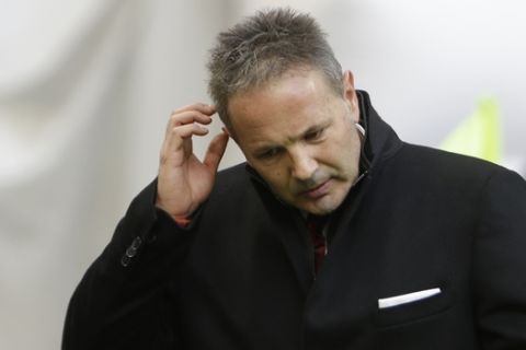 AC Milan coach Sinisa Mihailovic gestures as he walks prior to the start of a Serie A soccer match between AC Milan and Bologna, at the San Siro stadium in Milan, Italy, Wednesday Jan. 6, 2016. (AP Photo/Luca Bruno)