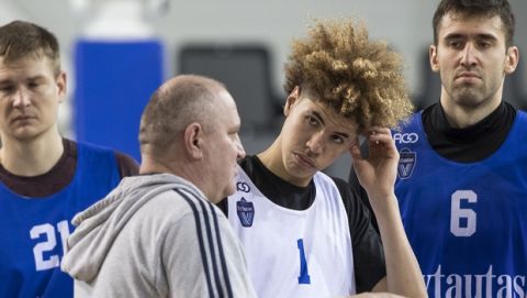 Lithuanian Basketball club Prienai-Birstonas Vytautas head coach Virginijus Seskus, left, talks to his player LaMelo Ball during a training session at the BC Prienai-Birstonas Vytautas arena in Prienai, Lithuania, Friday, Jan. 5, 2018. LiAngelo Ball and LaMelo Ball have signed a one-year contract to play for Lithuanian professional basketball club Prienai - Birstonas Vytautas, in the southern Lithuania town of Prienai, some 110 km (68 miles) from the Lithuanian capital Vilnius.(AP Photo/Mindaugas Kulbis)