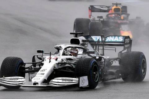 Mercedes driver Lewis Hamilton of Britain leads Red Bull driver Max Verstappen of the Netherland's during the German Formula One Grand Prix at the Hockenheimring racetrack in Hockenheim, Germany, Sunday, July 28, 2019. (AP Photo/Jens Meyer)