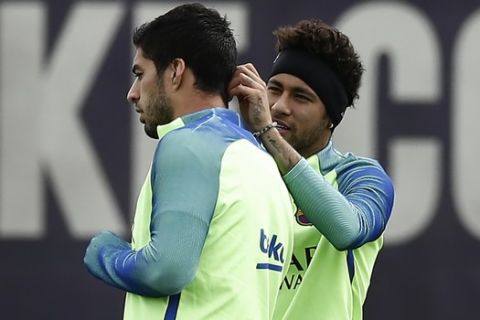 FC Barcelona's Neymar, right, and Luis Suarez during a training session at the Sports Center FC Barcelona Joan Gamper in Sant Joan Despi, Spain, Friday, May 5, 2017. FC Barcelona will play against Villarreal during a Spanish La Liga on Saturday. (AP Photo/Manu Fernandez)