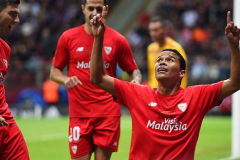 WARSAW, POLAND - MAY 27:  Carlos Bacca of Sevilla celebrates scoring his team's second goal with Jose Antonio Reyes (L) of Sevilla during the UEFA Europa League Final match between FC Dnipro Dnipropetrovsk and FC Sevilla on May 27, 2015 in Warsaw, Poland.  (Photo by Shaun Botterill/Getty Images)
