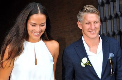 Tennis player Ana Ivanovic and Germany soccer player Bastian Schweinsteiger smile during their wedding, in Venice, Italy, Tuesday, July 12, 2016. (AP Photo/Luigi Costantini)