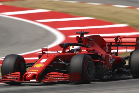 Ferrari driver Sebastian Vettel of Germany steers his car during a qualifying session prior to the Formula One Grand Prix at the Barcelona Catalunya racetrack in Montmelo, Spain, Saturday, Aug. 15, 2020. (Bryn Lennon, Pool via AP)