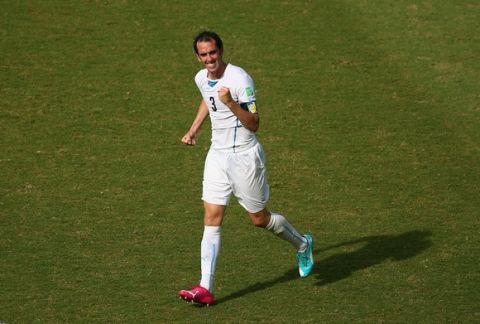 NATAL, BRAZIL - JUNE 24:  Diego Godin of Uruguay celebrates scoring his team's first goal during the 2014 FIFA World Cup Brazil Group D match between Italy and Uruguay at Estadio das Dunas on June 24, 2014 in Natal, Brazil.  (Photo by Julian Finney/Getty Images)