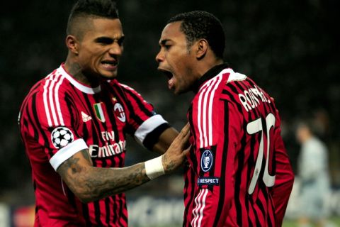 AC Milan's Brazilian forward Robinho (R) celebrates after scoring with team mate Ghanaian defender Prince Kevin Boateng during the UEFA Champions League round of 16 first leg match AC Milan vs Arsenal at San Siro stadium on February 15, 2012 in Milan. AFP PHOTO / GIUSEPPE CACACE (Photo credit should read GIUSEPPE CACACE/AFP/Getty Images)