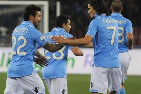 Napoli's Edinson Cavani, of Uruguay,right, celebrates with teammate Ezequiel Lavezzi, of Argentina, during a Cup of Italy semifinal soccer match between Napoli and Siena at the San Paolo stadium in Naples, Italy, Wednesday, March 21, 2012. Napoli won 2 - 0 to qualify for the final. (AP Photo/Salvatore Laporta)