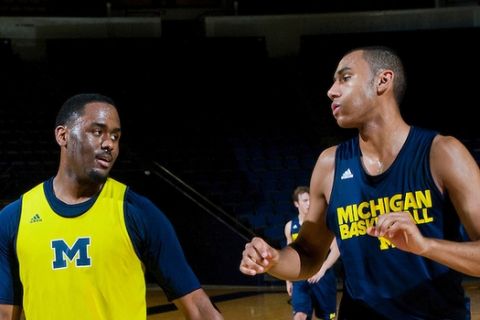 Michigan guard Jordan Dumars, left, and forward Jon Horford, right, during a team practice, Thursday, Nov. 11, 2010, at Crisler Arena in Ann Arbor, Mich. Dumars is the son of former Detroit Pistons All-star and current President of Pistons Basketball Joe Dumars, and Horford is the son of former Milwaukee Bucks' Tito Horford and brother to the Atlanta Hawks' Al Horford. (AP Photo/Tony Ding)