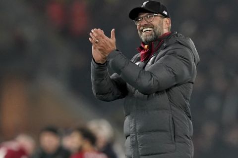 Liverpool's manager Jurgen Klopp celebrates after his team won the English Premier League soccer match between Liverpool and Manchester United at Anfield Stadium in Liverpool, Sunday, Jan. 19, 2020.(AP Photo/Jon Super)
