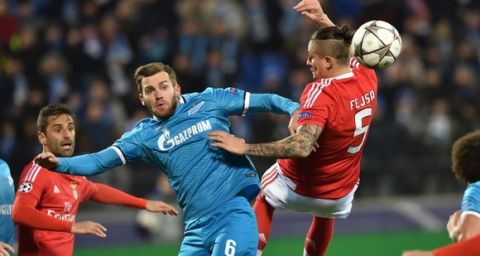 "Zenit's Belgian defender Nicolas Lombaerts vies for the ball with Benfica's Serbian midfielder Ljubomir Fejsa during the second-leg round of 16 UEFA Champions League football match FC Zenit vs SL Benfica at the Petrovsky stadium in St. Petersburg on March 9, 2016. AFP PHOTO / KIRILL KUDRYAVTSEV / AFP / KIRILL KUDRYAVTSEV        (Photo credit should read KIRILL KUDRYAVTSEV/AFP/Getty Images)"