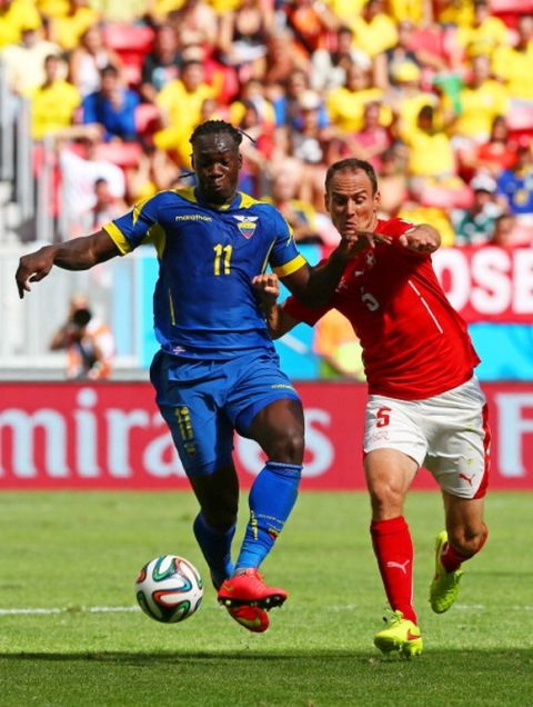 BRASILIA, BRAZIL - JUNE 15: Felipe Caicedo of Ecuador controls the ball against Steve von Bergen of Switzerland during the 2014 FIFA World Cup Brazil Group E match between Switzerland and Ecuador at Estadio Nacional on June 15, 2014 in Brasilia, Brazil.  (Photo by Clive Brunskill/Getty Images)