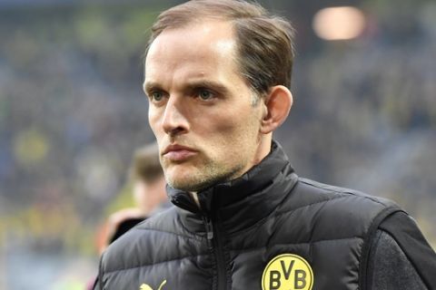 Dortmund's head coach Thomas Tuchel waits for the beginning of during the Champions League quarterfinal first leg soccer match between Borussia Dortmund and AS Monaco in Dortmund, Germany, Wednesday, April 12, 2017. (AP Photo/Martin Meissner)