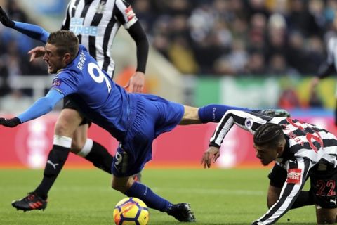 Leicester City's Jamie Vardy, left, and Newcastle United's DeAndre Yedlin battle for the ball during their English Premier League soccer match at St James' Park, Newcastle, England, Saturday, Dec. 9, 2017. (Owen Humphreys/PA via AP)