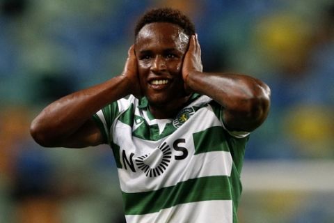 Sporting's Jovane Cabral celebrates after scoring the opening goal during the Portuguese League soccer match between Sporting CP and Pacos de Ferreira at the Jose Alvalade stadium in Lisbon, Portugal, Friday, June 12, 2020. The Portuguese League soccer matches are being played without spectators because of the coronavirus pandemic. (Antonio Cotrim/Pool via AP)